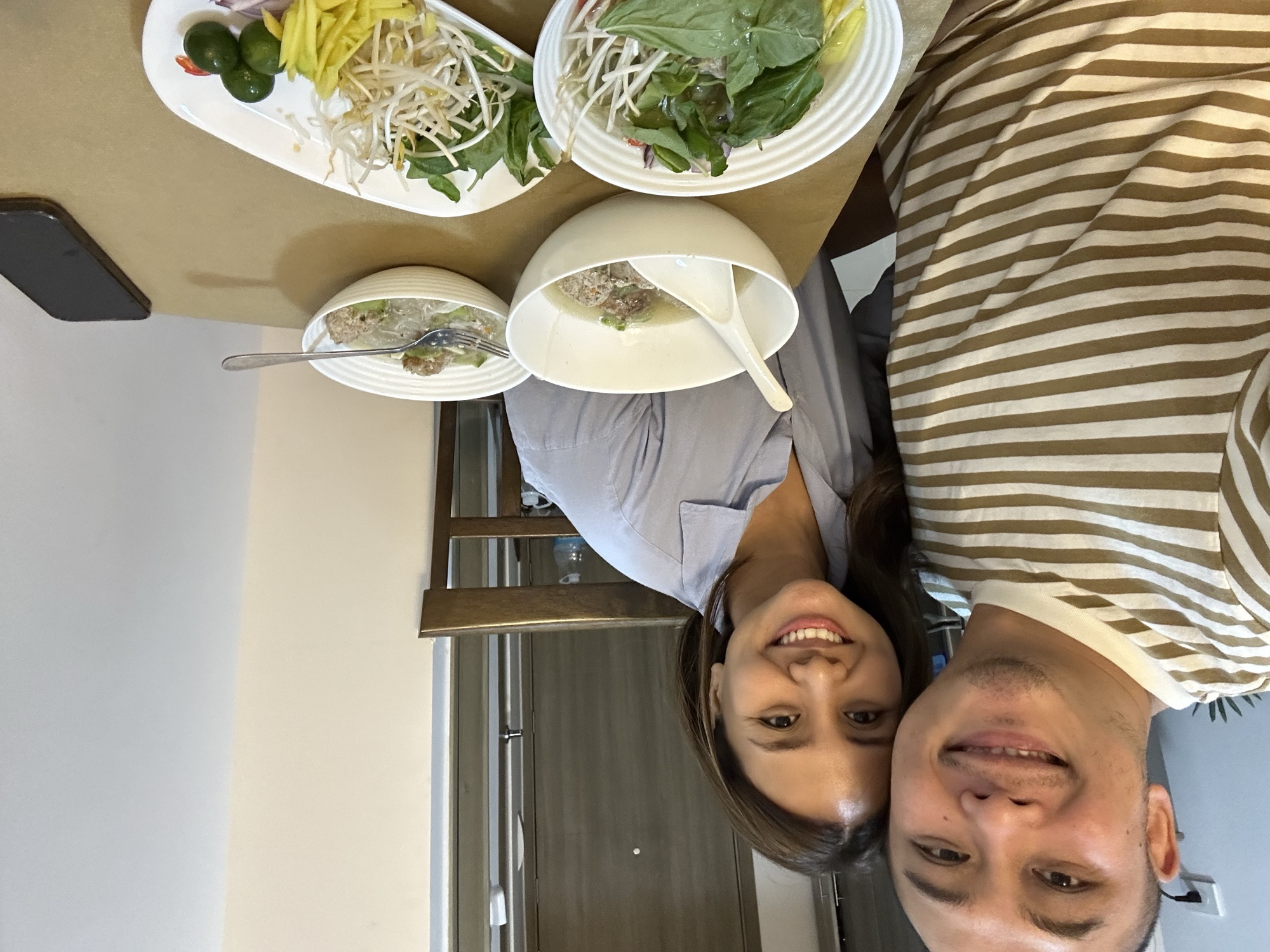 David and Chai at a table in Manila.