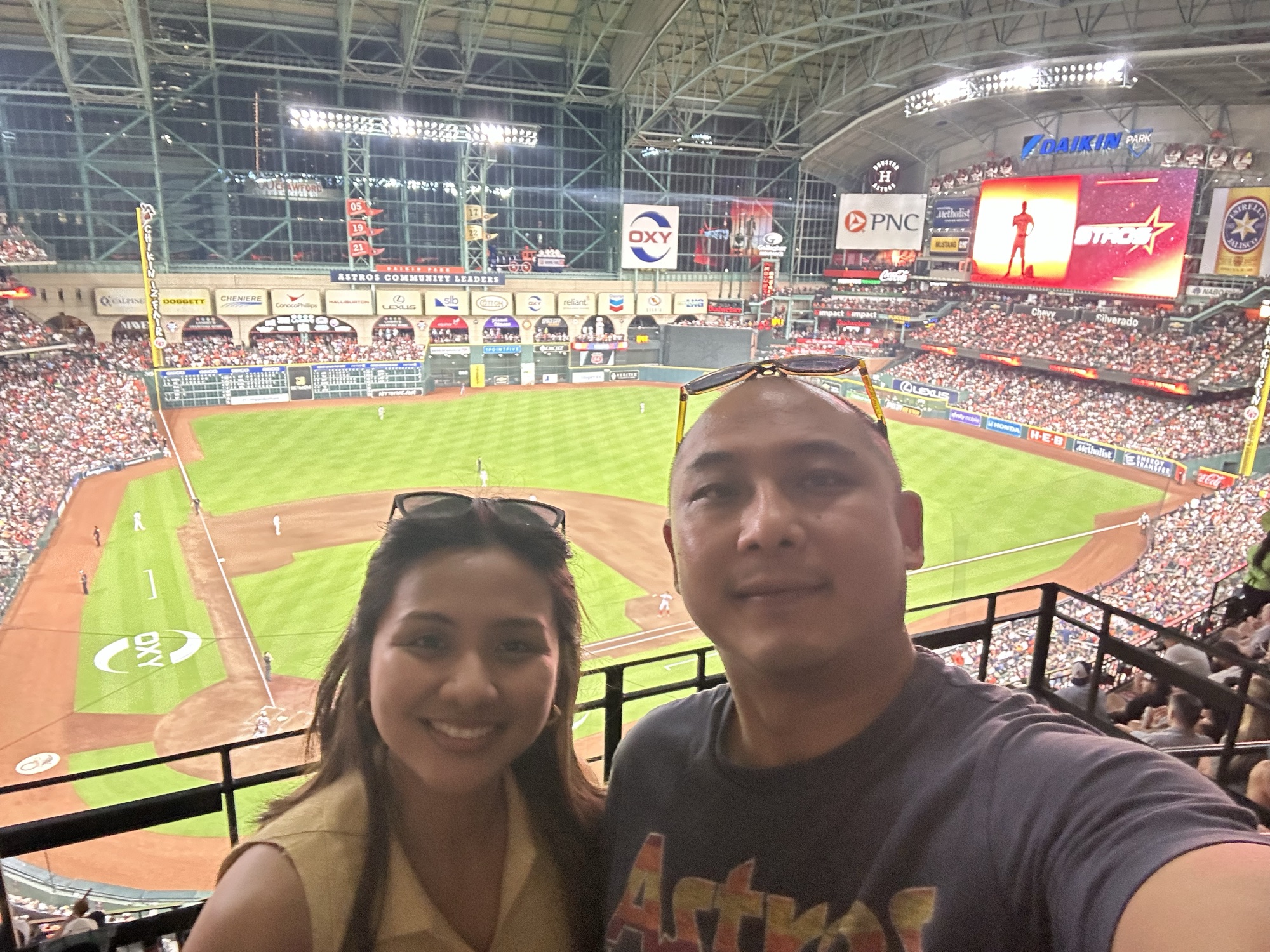 David and Chai at a baseball game in the United States.